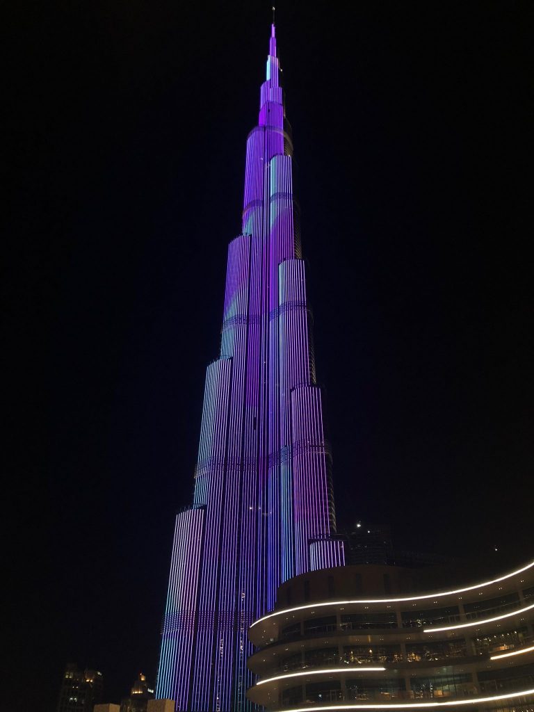 Burj Khalifa lit up in purple during light show in Dubai
