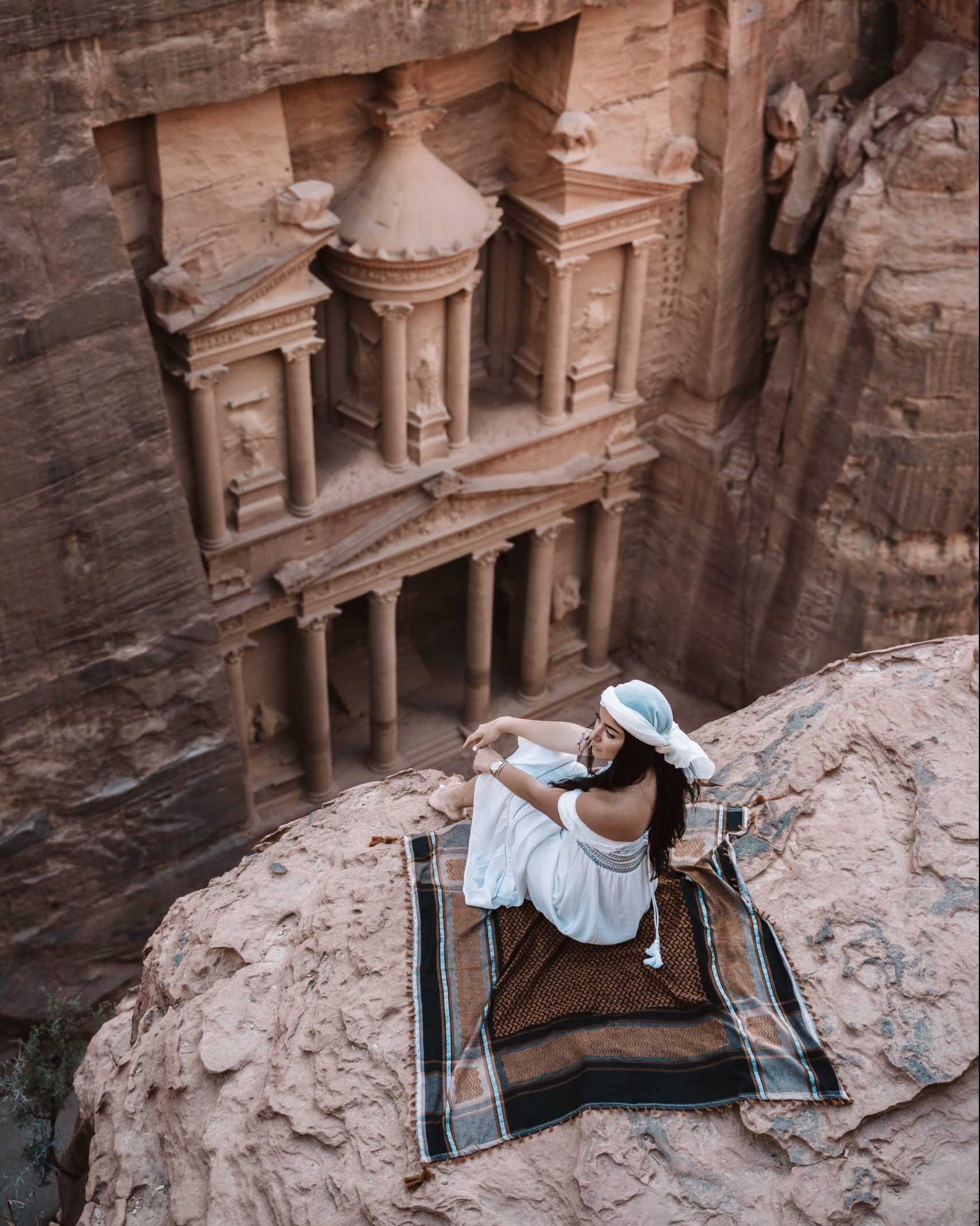 Girl sitting in front of the Monastery, Petra
